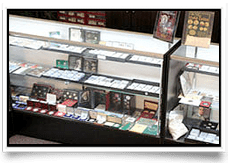 Display case with coins and collectibles.